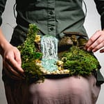 Miniature waterfall made with natural materials, stones and moss