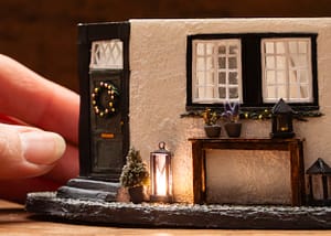 German miniature house with lantern A miniature German house with a little lantern lit with a micro led