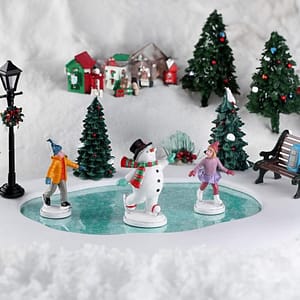 Kids and snowman skating on ice rink by Lemax