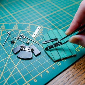 brooches as fairy door hinges Repurposing brooch backs as hinges for a miniature farm door