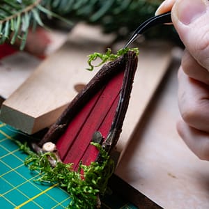 moss accents on red miniature door Adding moss accents to a red triangular miniature door
